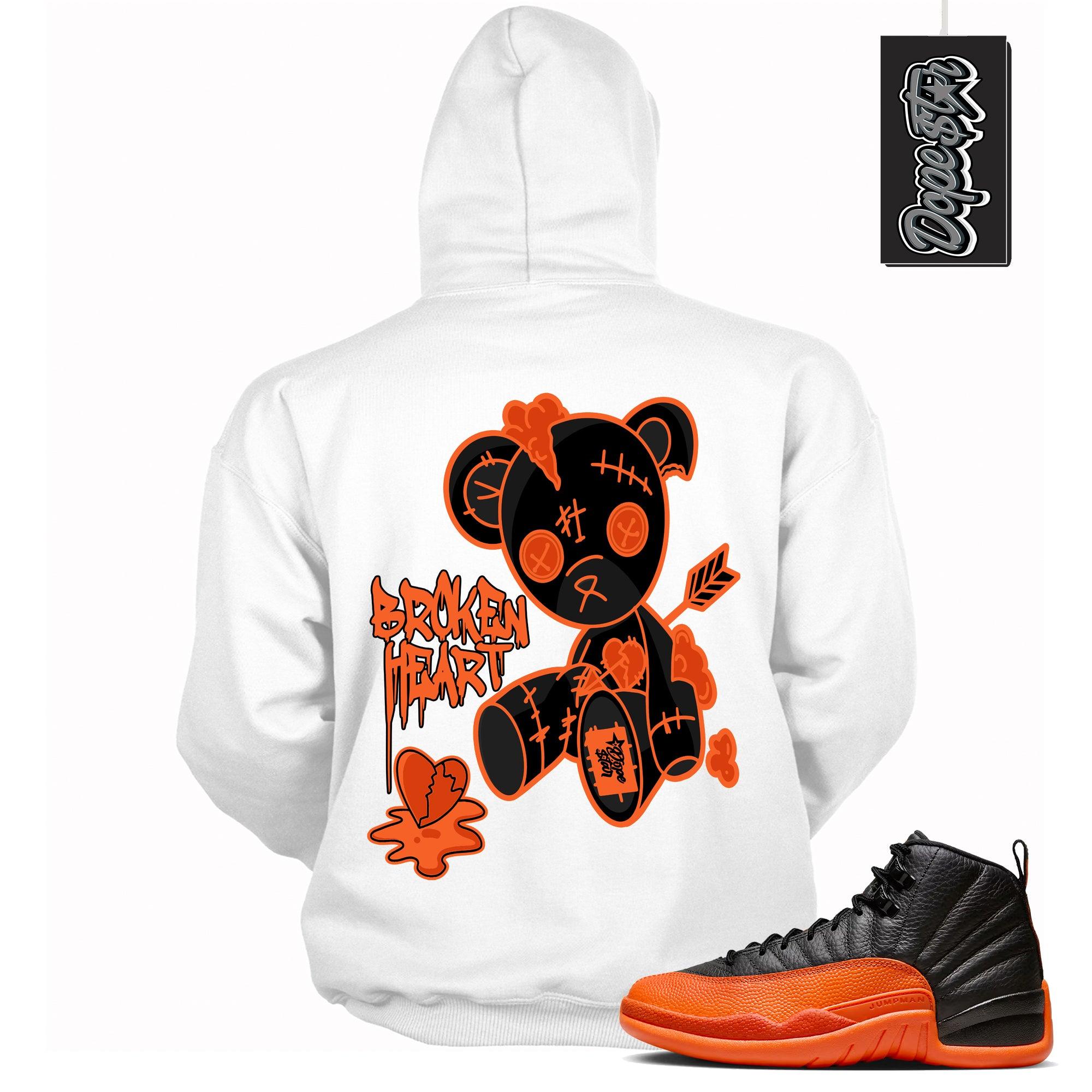 Cool White Graphic Hoodie with “ Broken Heart Bear “ print, that perfectly matches Air Jordan 12 Retro WNBA All-Star Brilliant Orange sneakers
