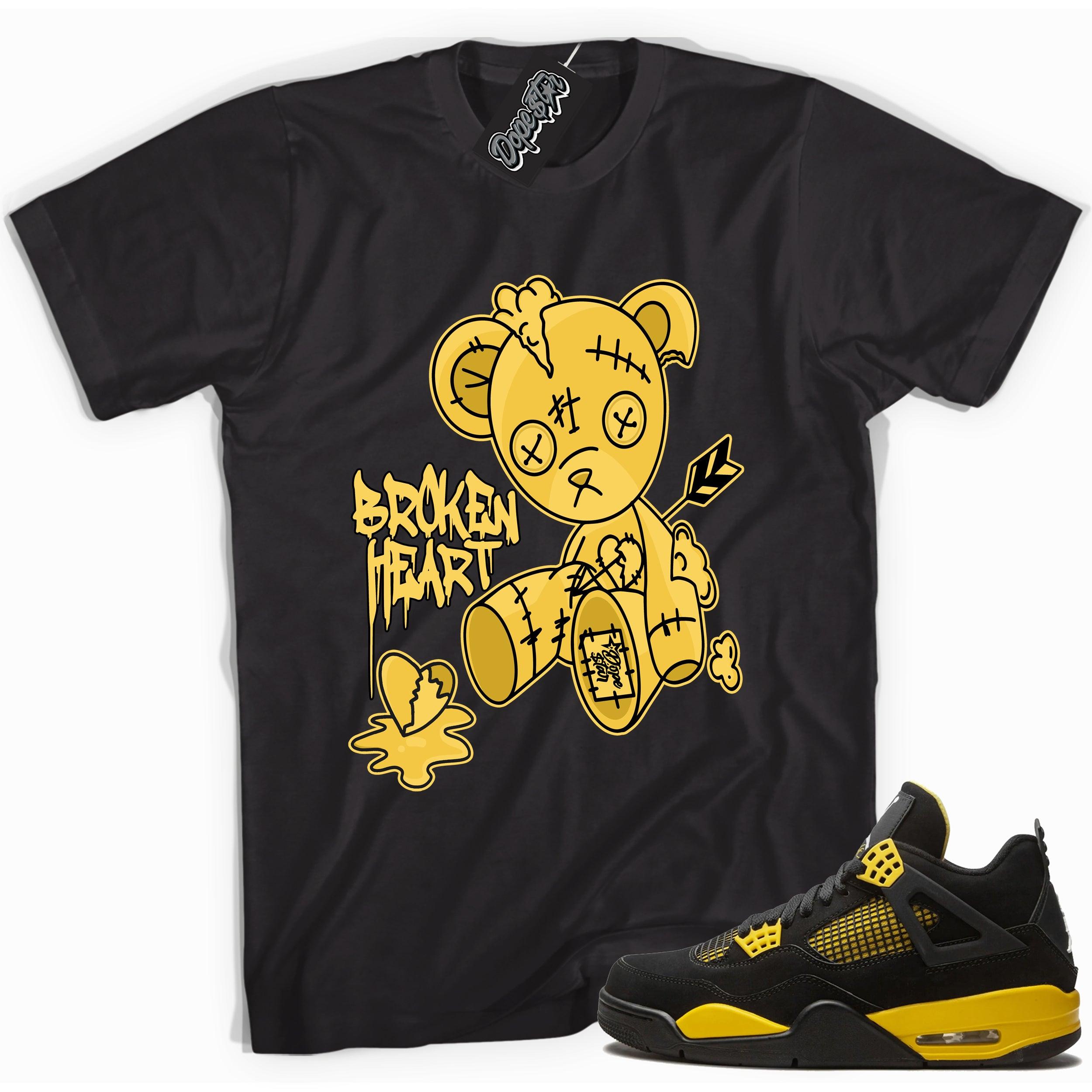 Cool black graphic tee with 'broken heart bear' print, that perfectly matches Air Jordan 4 Thunder sneakers