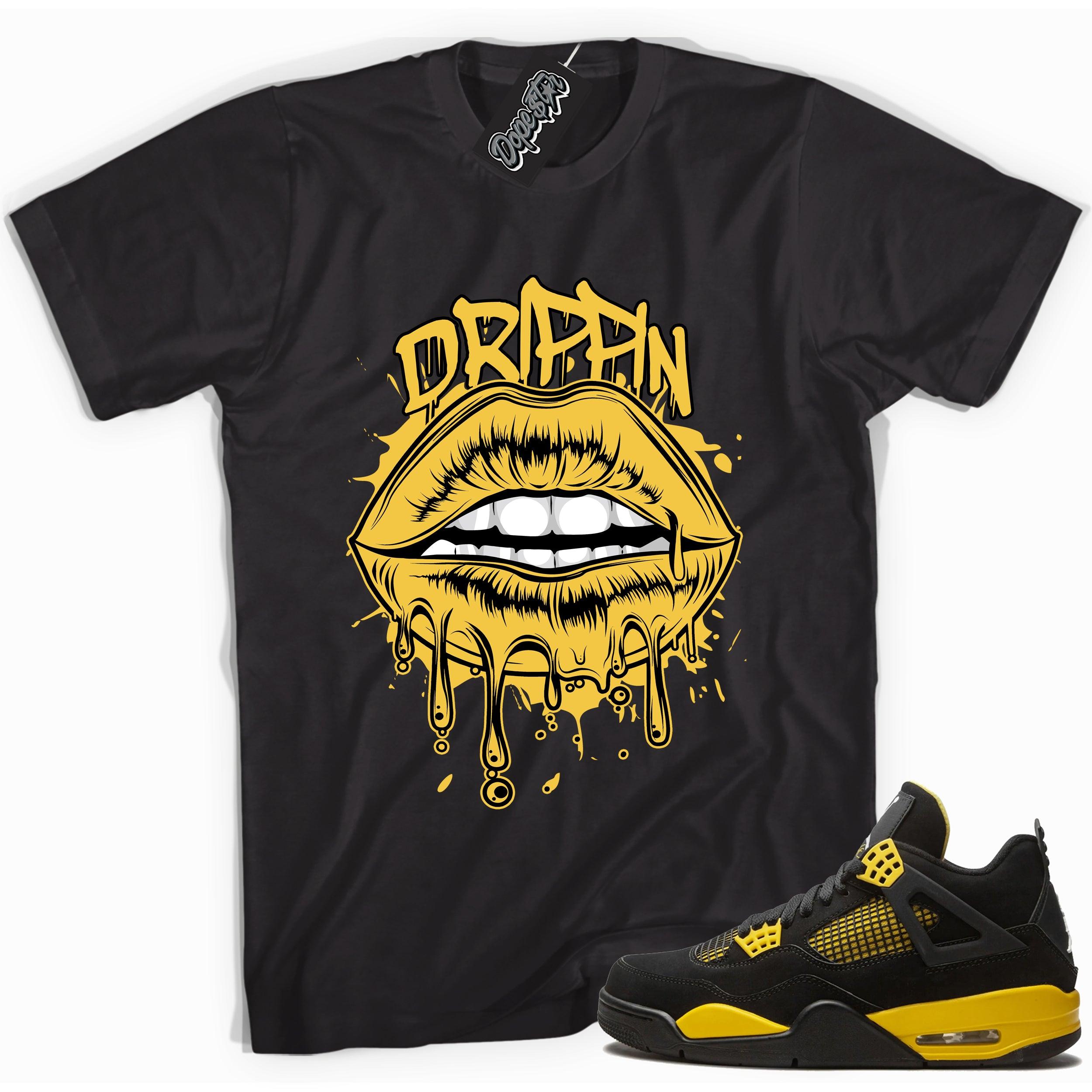 Cool black graphic tee with 'drippin' print, that perfectly matches Air Jordan 4 Thunder sneakers