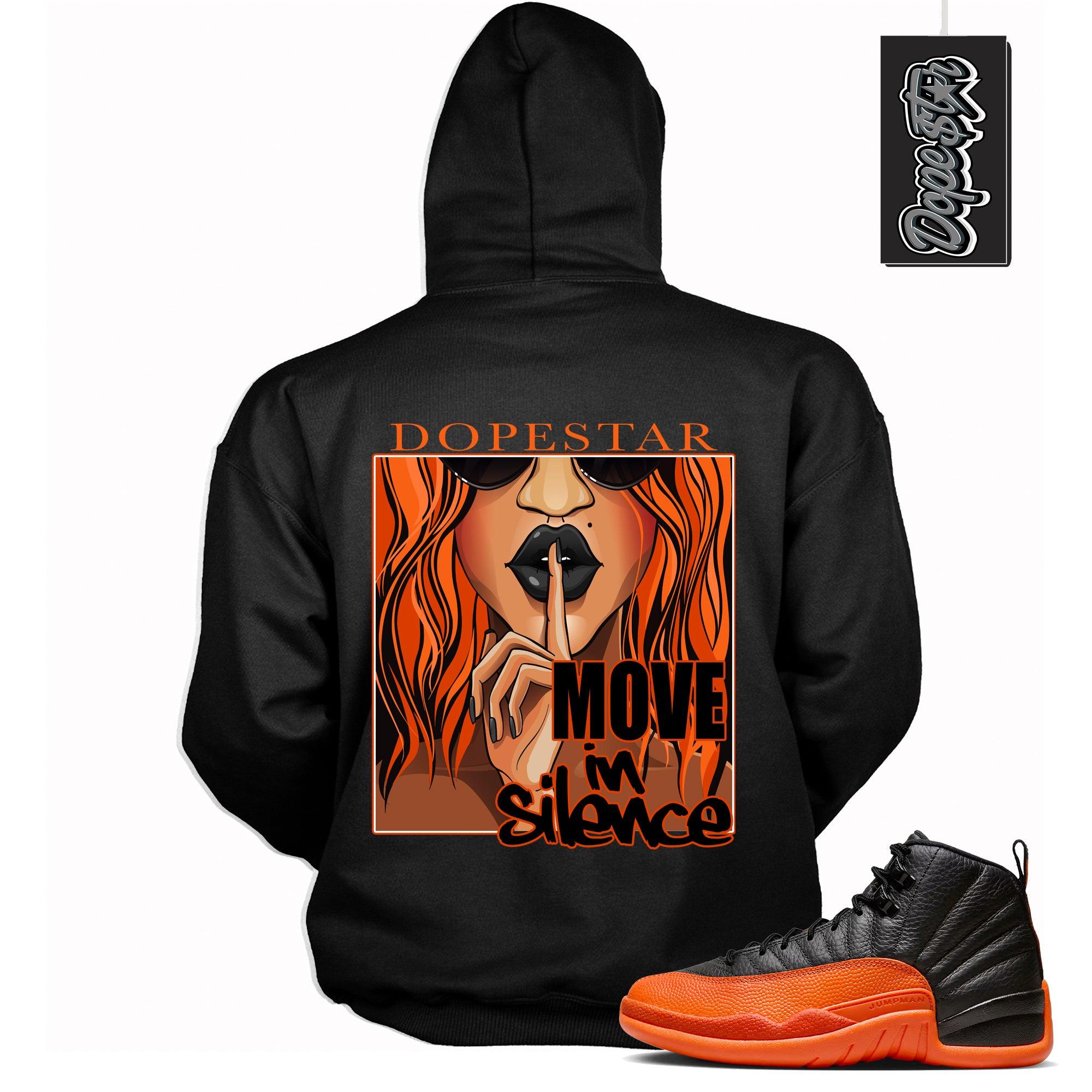 Cool Black Graphic Hoodie with “ Move In Silence “ print, that perfectly matches Air Jordan 12 Retro WNBA All-Star Brilliant Orange sneakers