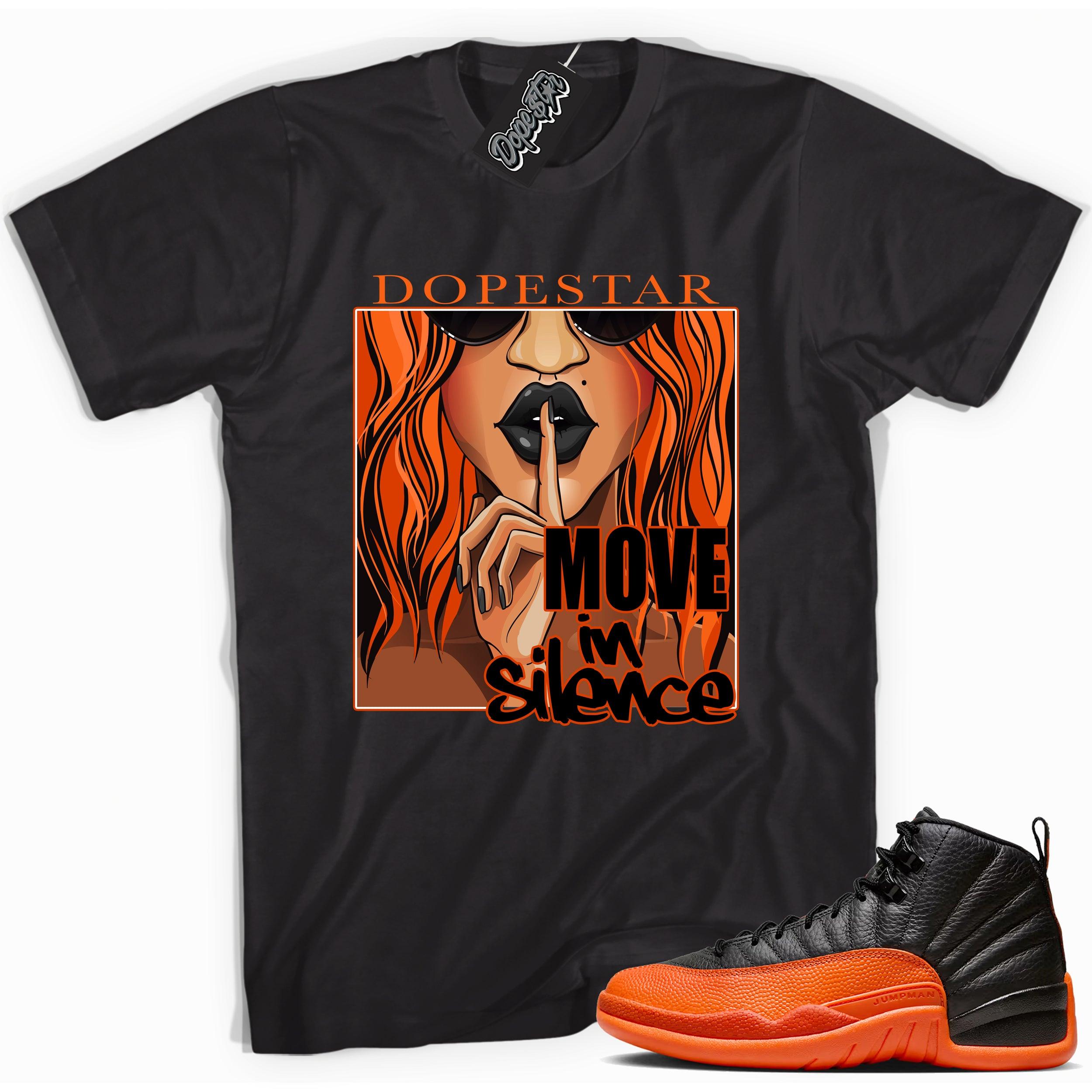 Cool Black graphic tee with “ Move In Silence ” print, that perfectly matches Air Jordan 12 Retro WNBA All-Star Brilliant Orange sneakers