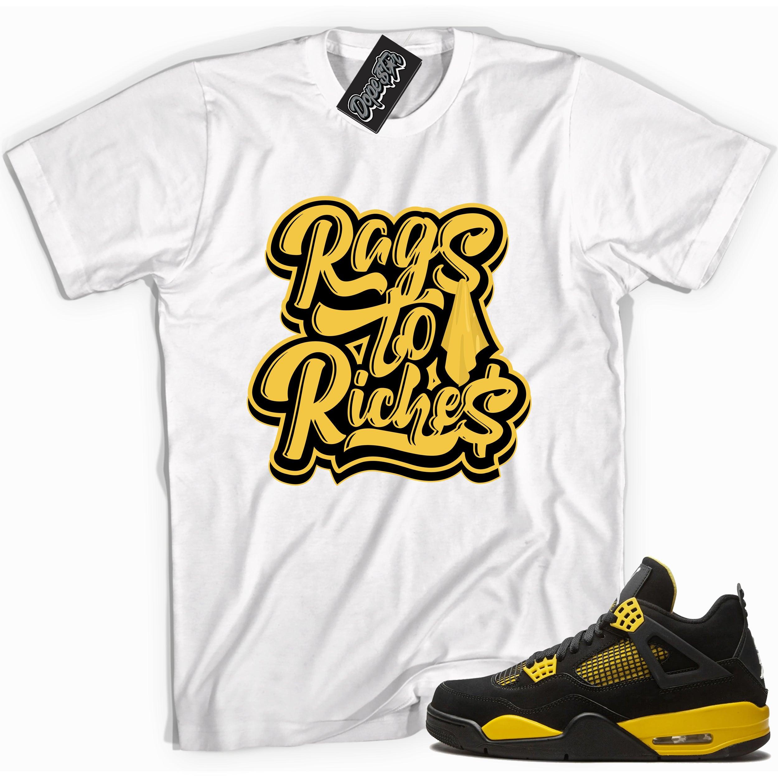 Cool white graphic tee with 'rags to riches' print, that perfectly matches Air Jordan 4 Thunder sneakers