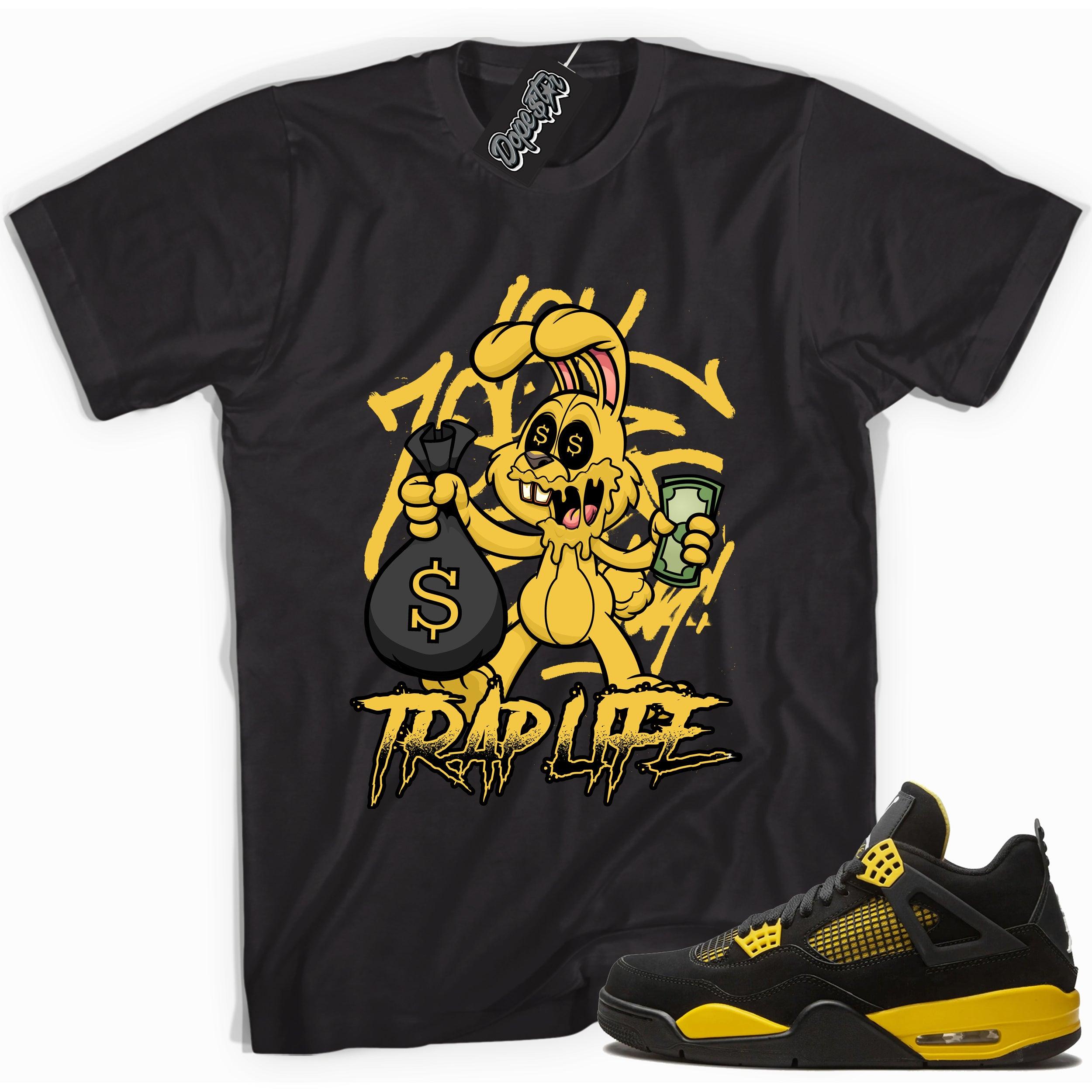 Cool black graphic tee with 'trap rabbit' print, that perfectly matches Air Jordan 4 Thunder sneakers