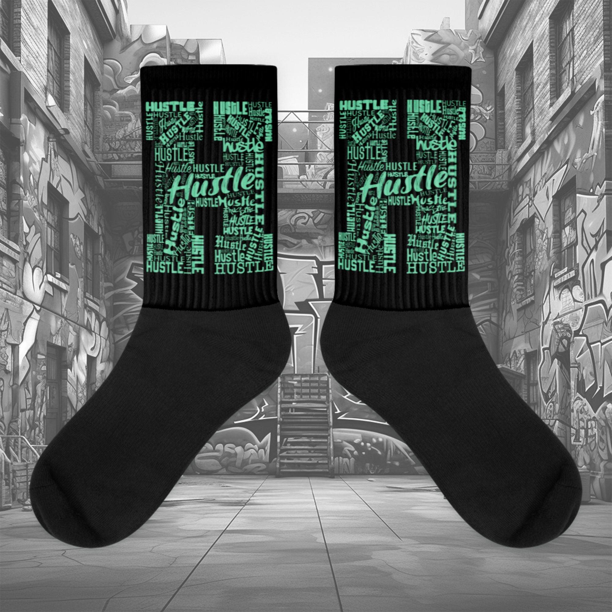 Showcases the view of the socks, highlighting the vibrant ' Hustle ' design, which perfectly complements the Nike Dunk Green Glow sneakers. The intricate pattern and color scheme inspired by the theme are prominently displayed. Focusing on the ribbed leg , cusioned bottoms and the snug fit of the socks. This angle provides a clear view of the texture and quality of the material blend.