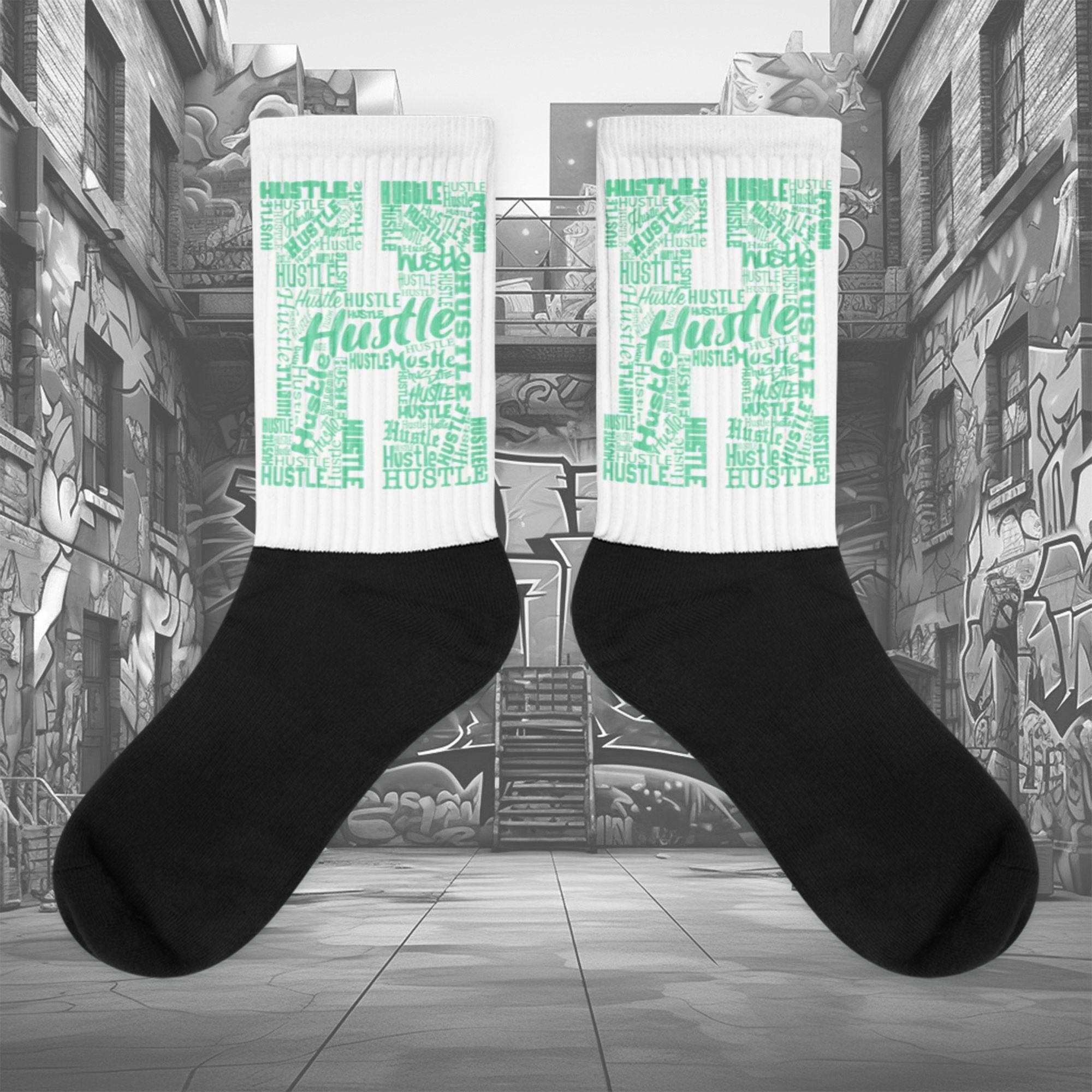 Showcases the view of the socks, highlighting the vibrant ' Hustle ' design, which perfectly complements the Nike Dunk Green Glow sneakers. The intricate pattern and color scheme inspired by the theme are prominently displayed. Focusing on the ribbed leg , cusioned bottoms and the snug fit of the socks. This angle provides a clear view of the texture and quality of the material blend.