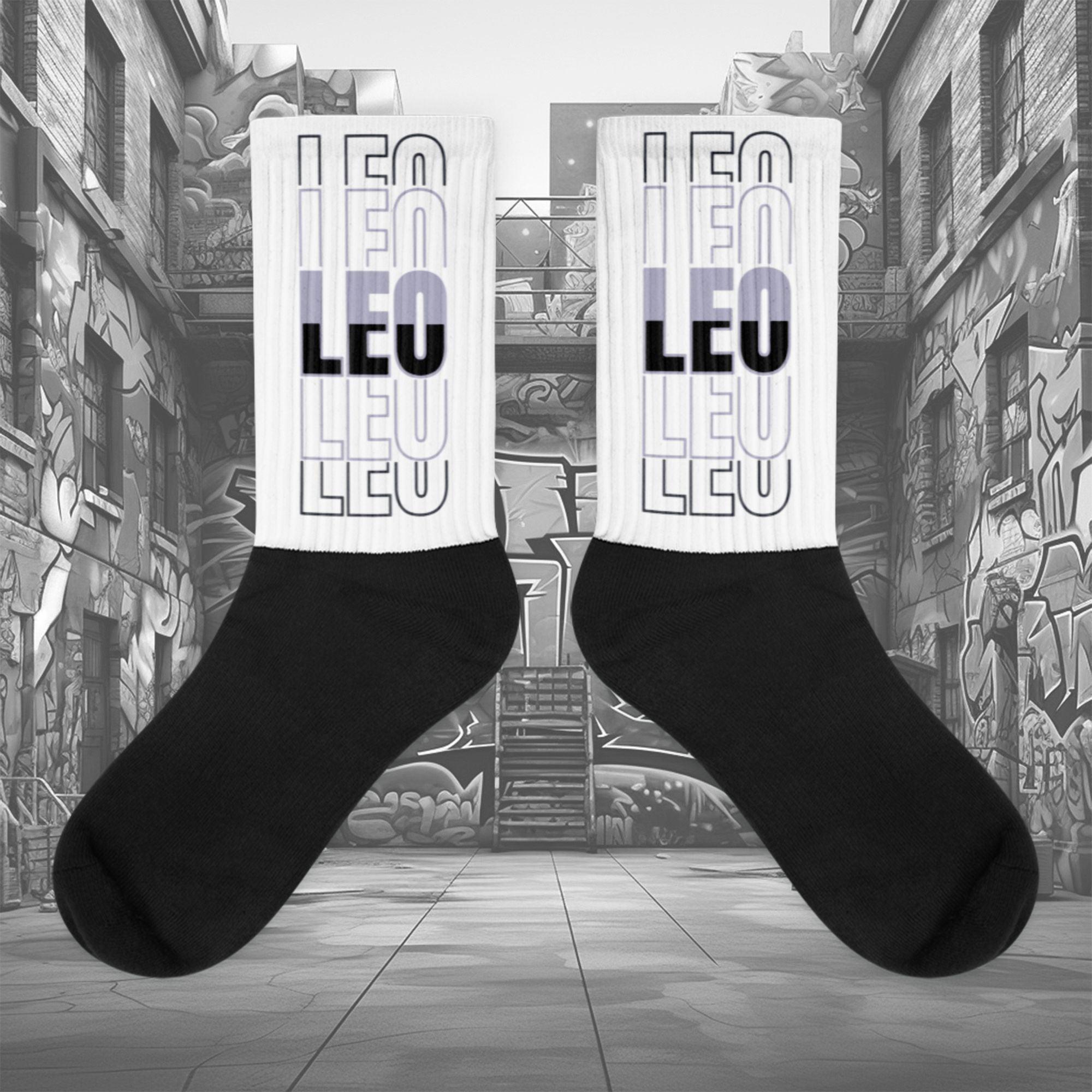 Showcases the view of the socks, highlighting the vibrant 'LEO' design, which perfectly complements the Air Jordan 8 Winterized sneakers. The intricate pattern and color scheme inspired by the theme are prominently displayed. Focusing on the ribbed leg , cusioned bottoms and the snug fit of the socks. This angle provides a clear view of the texture and quality of the material blend.