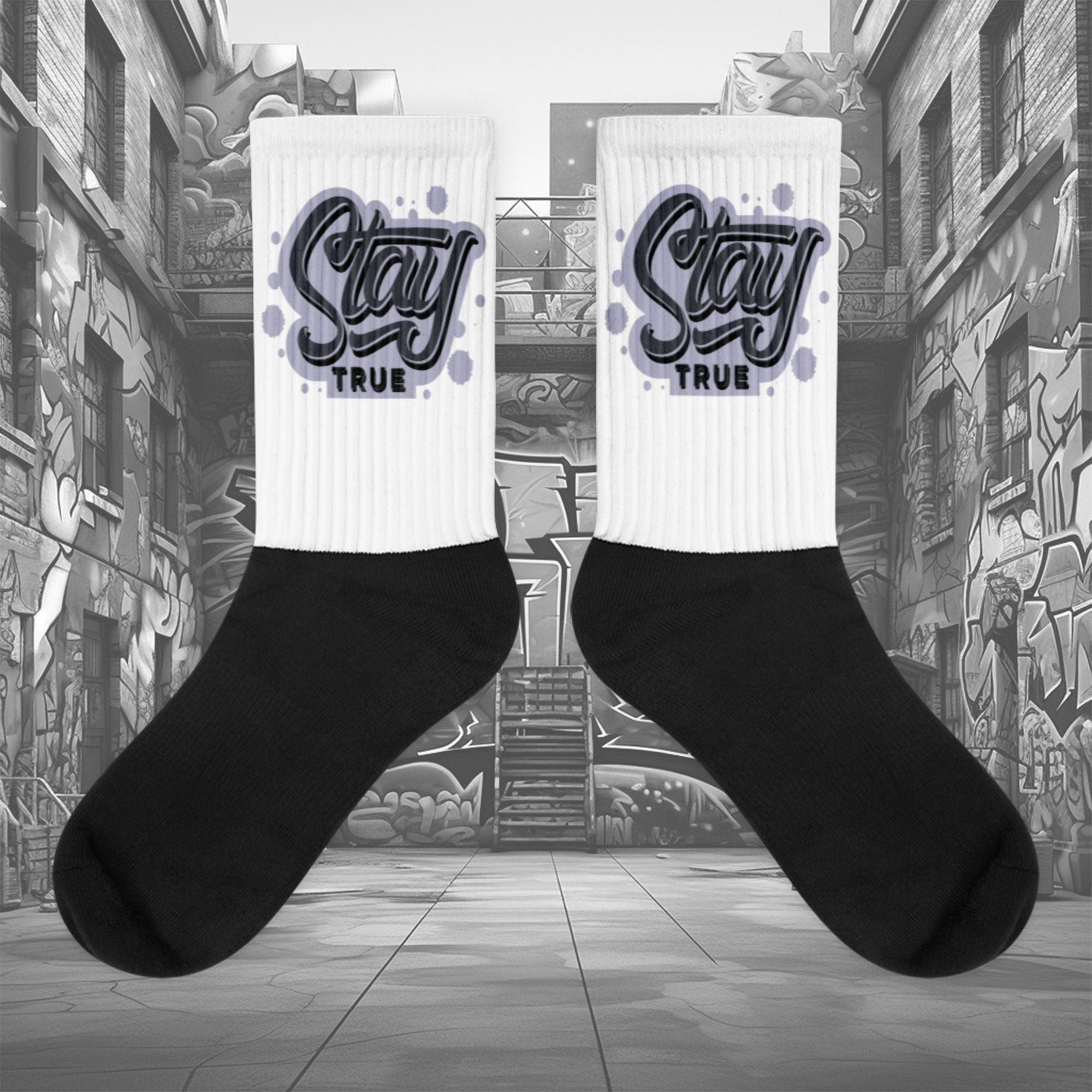 Showcases the view of the socks, highlighting the vibrant 'Stay True' design, which perfectly complements the Air Jordan 8 Winterized sneakers. The intricate pattern and color scheme inspired by the theme are prominently displayed. Focusing on the ribbed leg , cusioned bottoms and the snug fit of the socks. This angle provides a clear view of the texture and quality of the material blend.