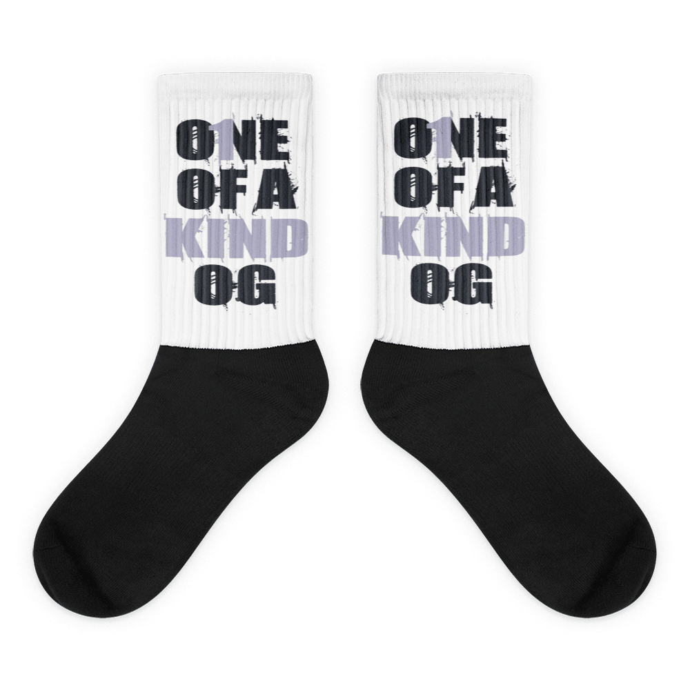 Showcases the view of the socks, highlighting the vibrant 'One Of A Kind OG' design, which perfectly complements the Air Jordan 8 Winterized sneakers. The intricate pattern and color scheme inspired by the theme are prominently displayed. Focusing on the ribbed leg , cusioned bottoms and the snug fit of the socks. This angle provides a clear view of the texture and quality of the material blend.